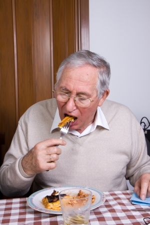 old man eatingの写真素材