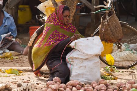 zanzibar market place woman selling her vegetablesのeditorial素材