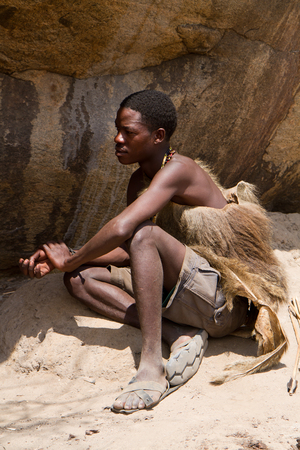 hadzabe tribe young man relaxing in the sunのeditorial素材
