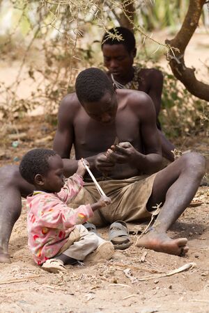 hadzabe tribe, family gathering, only 1000 people are left, they live in the old way