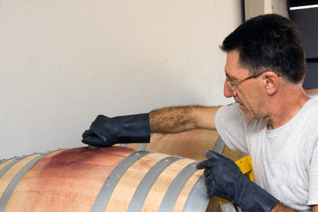 changing wine in a oak barrelの写真素材