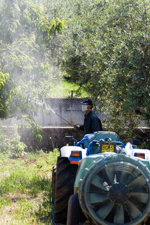farming man using pesticideの写真素材