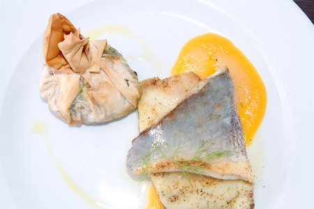 codfish served hot on a plate
