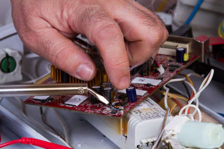 electrician fixing  electrical devices with different toolsのeditorial素材