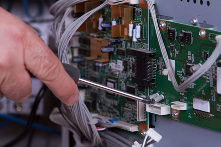 electrician fixing electrical deviceのeditorial素材