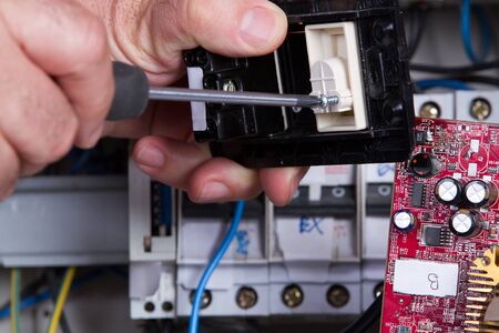 electrician fixing electrical deviceのeditorial素材