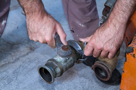 repairman at work during maintenance workの写真素材