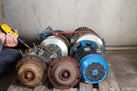 repairman during maintenance work of electric motorsの写真素材