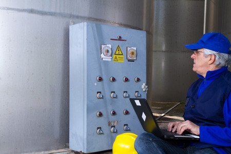 electrician at work with an electric panel