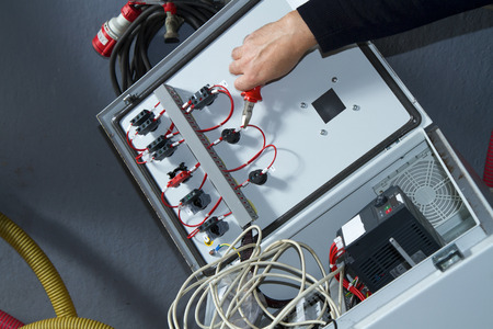 technician at maintenance work with an electric pump