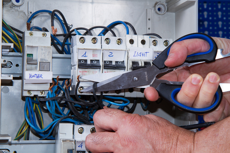 electrician at work with an applianceの写真素材