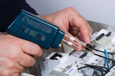 electrician at work with an applianceの写真素材