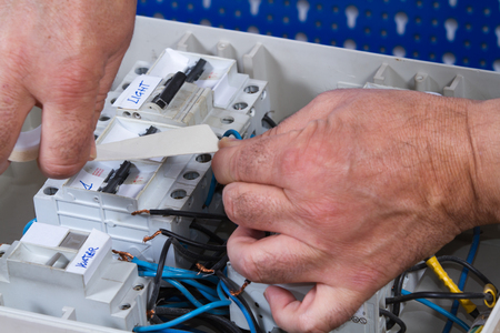 electrician at work with an applianceの写真素材