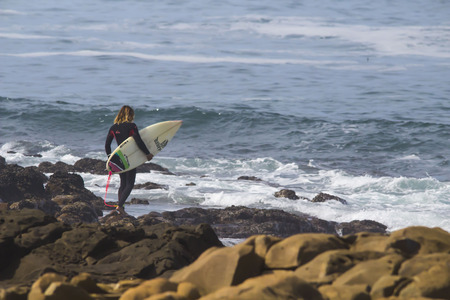 Surfer looking at sea