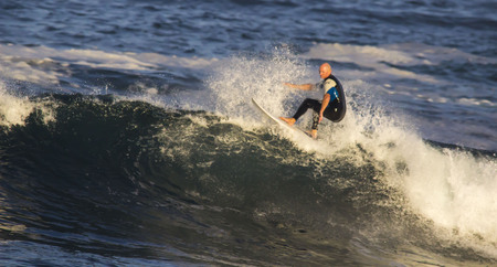 Surfer Riding waves