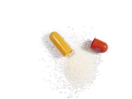 Opened pill, isolated in whiteの写真素材