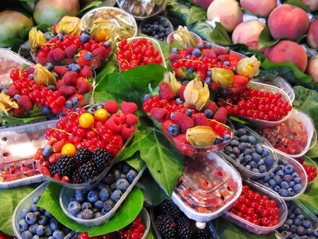 Fruits market (La Boqueria,Barcelona famous marketplace). Red and black berriesの写真素材