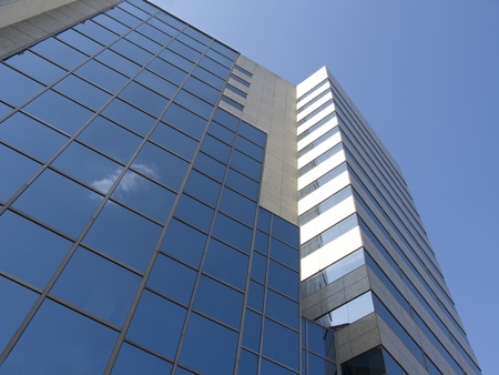 Glass building in the city over the sky