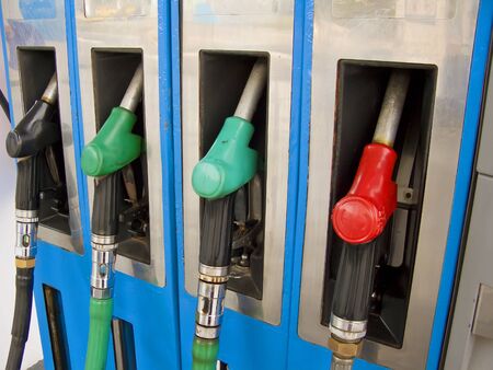 Four petrol pumps, close up