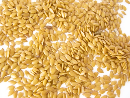 A bunch of flax seeds (Linum usitatissimum), isolated on white backgroundの写真素材