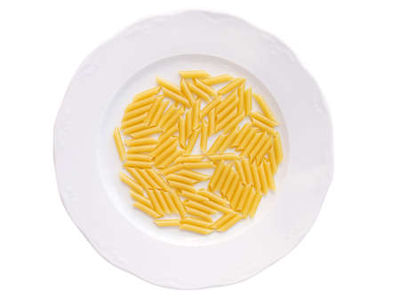Dried macaroni pasta, in a plateの写真素材