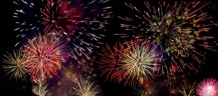 Colorful fireworks over dark sky during a celebration