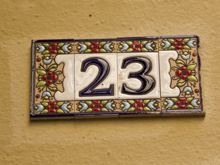 Number twenty three in a ceramic tile on streetの写真素材