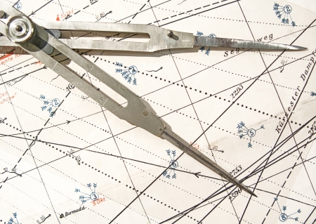 Old brass dividers on a nautical chartの写真素材