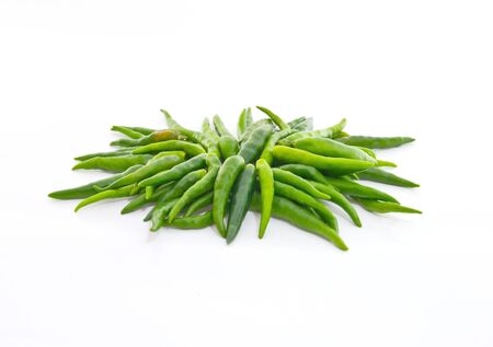Green chili bunch on the white backgroundの写真素材