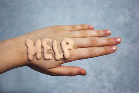 dry hands ask for help. in the creamの写真素材