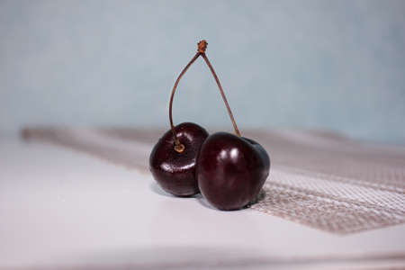 juicy maroon cherries in dropsの写真素材