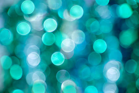 Defocused blurry f festive background for Christmas in blue and green colorsの写真素材