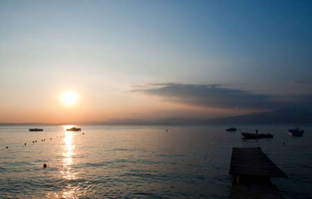 Lake Garda is the largest lake in Italy. It is located in Northern Italy, about half-way between Brescia and Verona, and between Venice and Milan. Glaciers formed this alpine region at the end of the last ice age.の写真素材