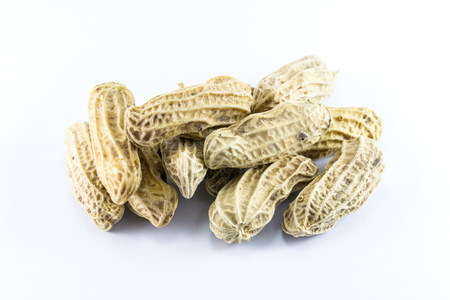 Closeup of peanuts on white backgroundの写真素材