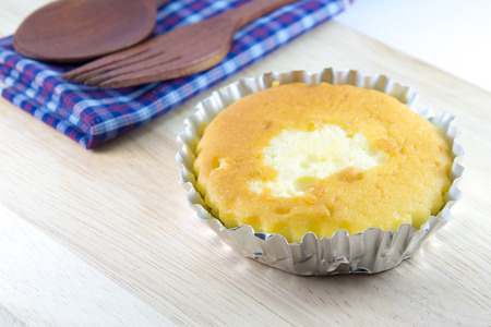 Butter cake in foil cup on wood desk with spoon and fork     Image ID:337422587     Copyright: Tendo     Available in high-resolution and several sizes to fit the needs of your project.  Get Started for Free Username Email Address Password I agree to Shutの写真素材