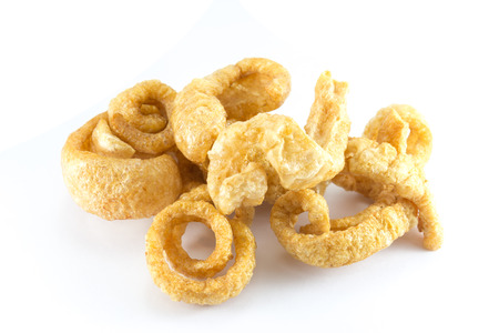Pork snack, Pork rind, Pork scratching or pork crackling on wihte backgroundの写真素材