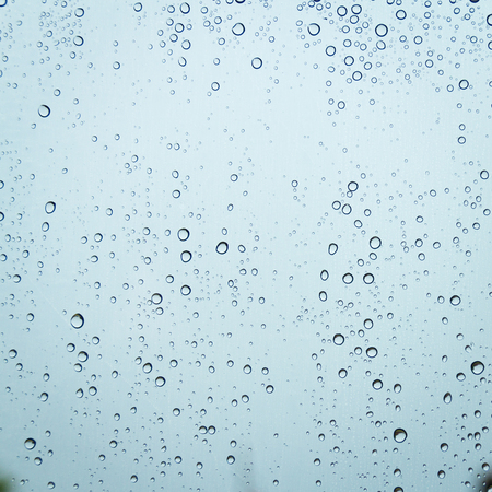 Water drops on glass or rain dropの写真素材