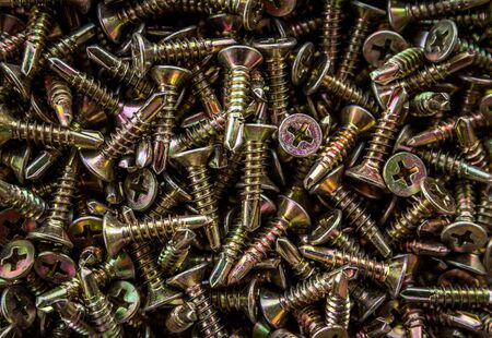Closeup of steel screws backgroundの写真素材
