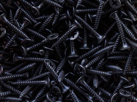 Closeup of steel screws backgroundの写真素材