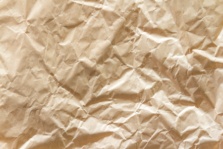 Brown wrinkle recycle paper backgroundの写真素材