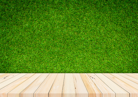 Wood plank with abstract green garss background for product displayの写真素材