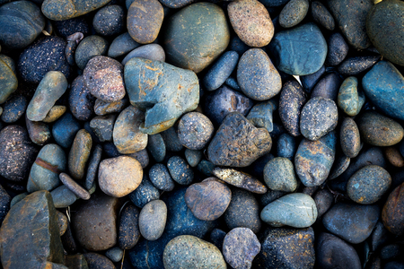 Grey pebbles stone backgroundの写真素材
