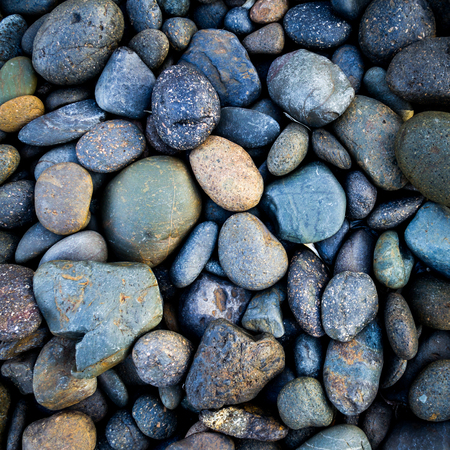 Grey pebbles stone backgroundの写真素材