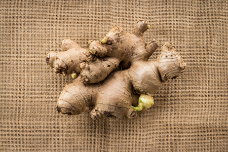ginger root on burlap backgroundの写真素材