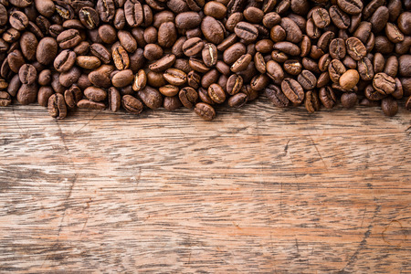Flame with Coffee beans on old wood backgroundの写真素材