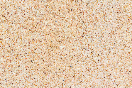 small stones wall or Pebbles and sand wall texture backgroundの写真素材