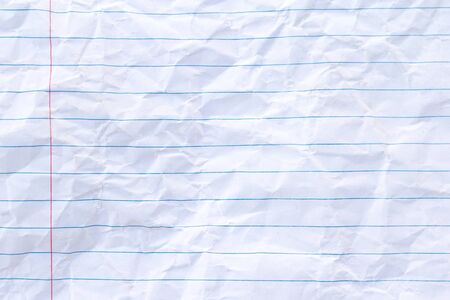 White lined sheet of notepad wrinkle paper backgroundの写真素材