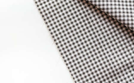 Classic black and white plaid fabric or tablecloth on white background
