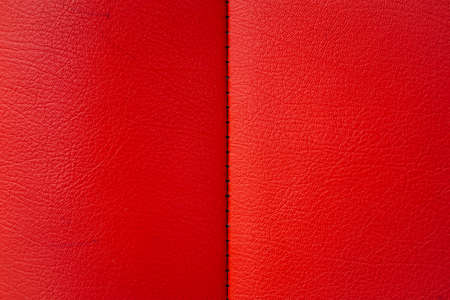 Red leather texture from sofa can be use as backgroundの写真素材