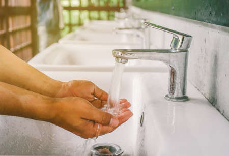 Close up Hand washing at 
Public toiletの写真素材